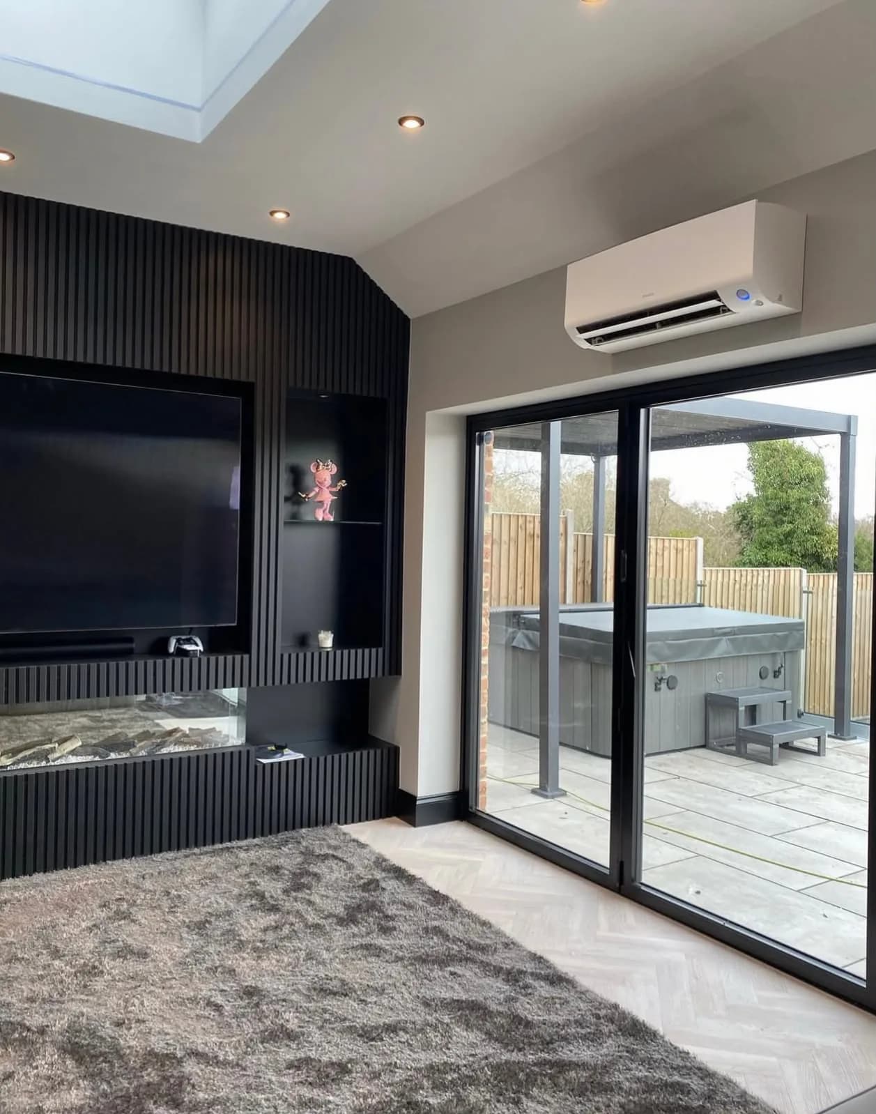 Daikin air conditioning in a garden room extension with glazed doors in Welwyn Garden City